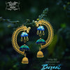 Gold and blue earrings with umbrella design on a dark green background
